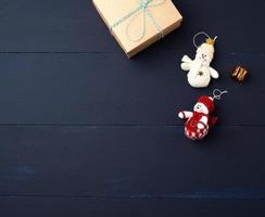 brown cardboard gift square box on a blue wooden background photo