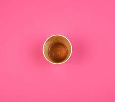 empty used red paper cup from under coffee photo