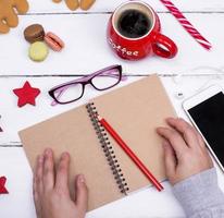 open empty notebook with a red pencil photo