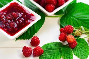 Fresh ripe red raspberry and raspberry jam photo