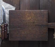 very old brown wooden kitchen cutting board photo