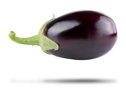 whole purple fresh eggplant with green base isolated on white background photo