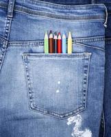 colored pencils in the back pocket of blue jeans photo