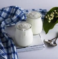 two glass jars with homemade yogurt photo