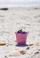 bucket full of wooden multicolored letters photo