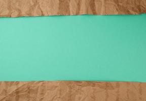 abstract green background with brown torn paper elements photo