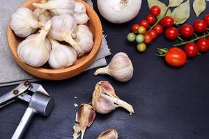 Fresh garlic in a wooden bowl photo