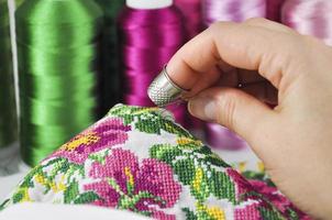 Embroidered flowers on silk fabric photo