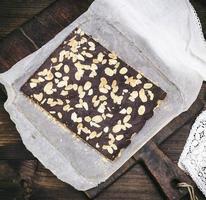 baked chocolate cake with almond chips photo