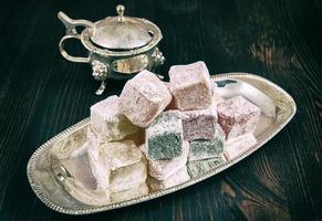 Rose flavoured Turkish delight in traditional silver bowl photo