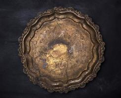 empty round copper plate with monograms photo