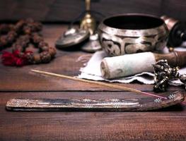 incense stick on a wooden stand photo