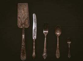 Kitchen accessories on a black wooden surface photo