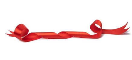 swirling red silk ribbon on white background, gift wrapping decor photo