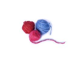 three multicolored woolen tangle for knitting photo
