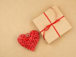 gift wrapped in brown kraft paper and tied with a thin silk ribbon photo