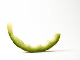 eaten stub of melon on a white background photo