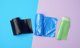 three rolled up rolls with plastic garbage bags photo