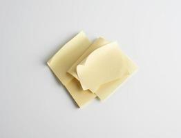 stack of yellow paper stickers on white background photo