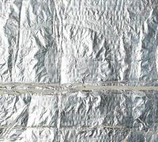 crumpled silver foil sheet, full frame photo