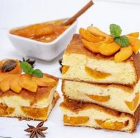 baked apricot biscuit cake, square pieces photo