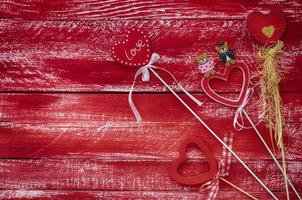 Carved wooden heart on a wooden background photo