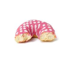 bitten off donuts with pink icing isolated on white background photo