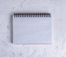 open notebook with blank white sheets photo