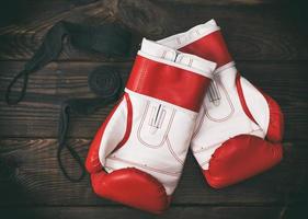 a pair of leather red boxing gloves photo