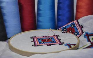 Embroidery cross pattern in the hoop, macro photo