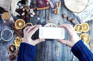smartphone in female hands, process of photographing food photo