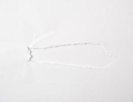 white sheet of paper with a hole, full frame photo