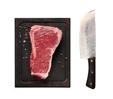fresh raw piece of beef meat, striploin steak on a black background, top view. Meat New York photo