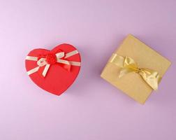 two cardboard holiday boxes on a purple background photo