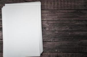 stack of sheets on white brown wooden surface photo