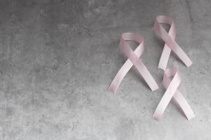 Pink ribbon on gray background.Symbol of breast cancer.