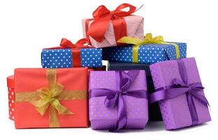 stack of boxes wrapped in paper and tied with a silk ribbon on a white background, celebration photo