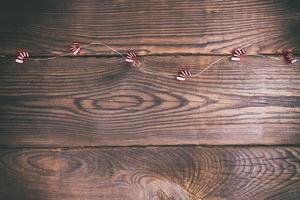 brown wood background and festive garland photo