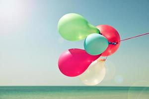 Multicolored balloons against the sky photo