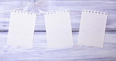 Three blank paper sheets in a line photo