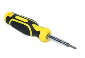 Screwdriver with a rubber handle on a white isolated background photo