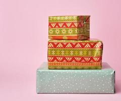 stack of colored paper wrapped gift boxes photo