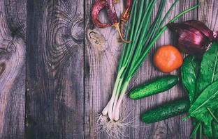 Fresh vegetables on a gray wooden surface photo