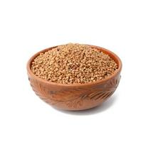 raw buckwheat grains in brown ceramic plate photo