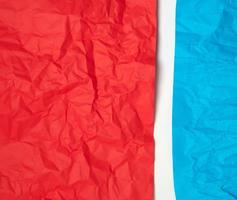 crumpled red and blue on paper on a white background photo