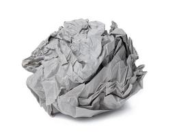 Crumpled gray sheet of paper isolated on white background photo