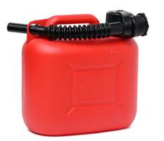 Red plastic canister for liquid fuels and lubricants on a white isolated background photo