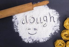 wheat flour and the inscription on the flour dough photo