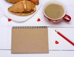 empty paper notebook with brown pages photo