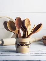 wooden spoons and forks in a wooden container photo